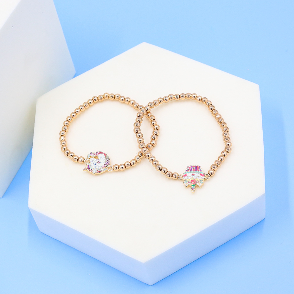 gold beaded charm bracelets – unicorn & cupcake