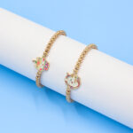 gold beaded charm bracelets – unicorn & cupcake