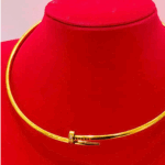 gold tone nail collar necklace with crystal accent