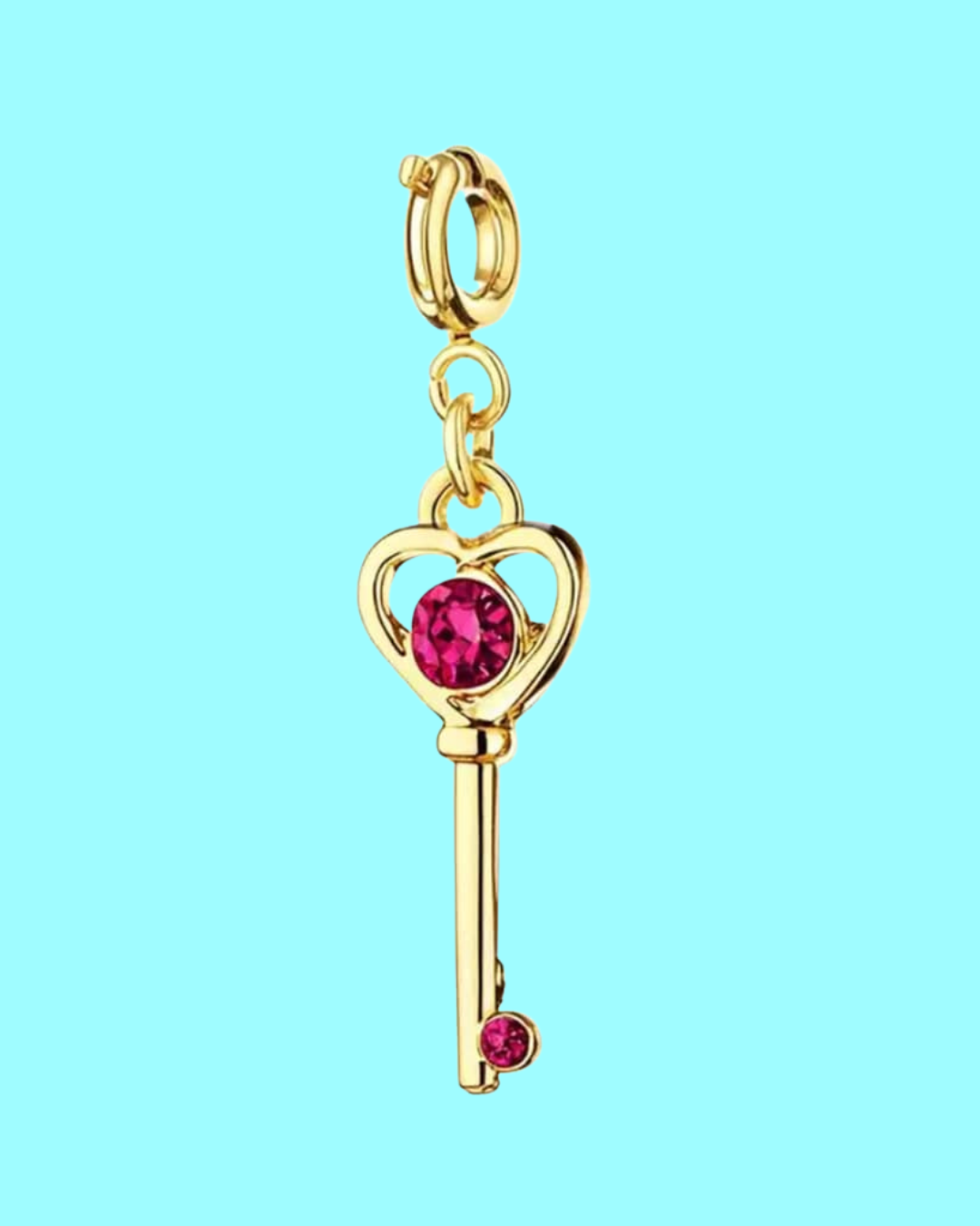 gold heart key charm pendant with pink crystals