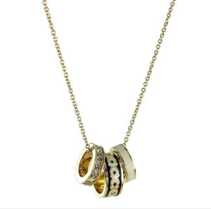coach signature enamel ring with crystals.