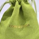 elegant gold toned hinged logo bangle