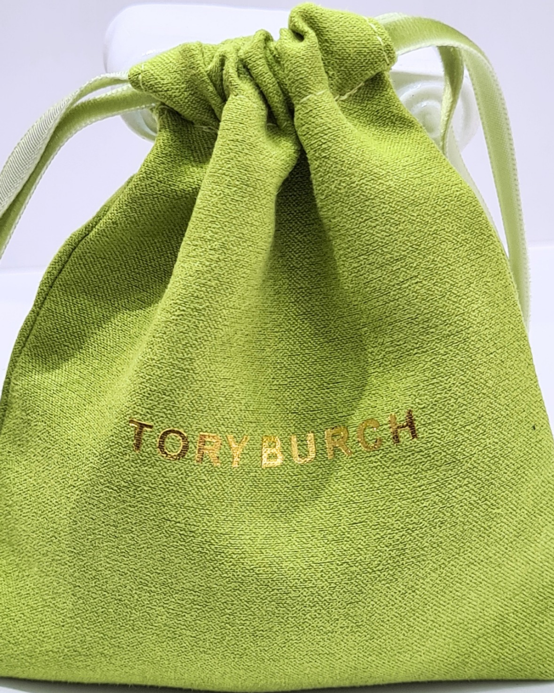 elegant gold toned hinged logo bangle