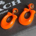 coach large signature enamel earring in orange with crystal stud