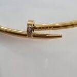 gold tone nail collar necklace